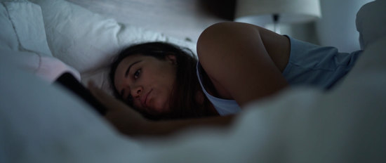 Loner_still_2_Woman_on_bed.png
